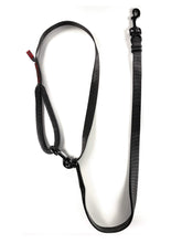 Load image into Gallery viewer, gearleash apex over the shoulder dog leash with full adjustability, mill-spec materials, and round padded handle seen here in black in it's over the shoulder position