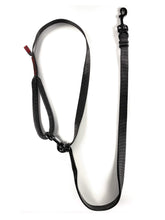 Load image into Gallery viewer, gearleash apex over the shoulder dog leash with full adjustability, mill-spec materials, and round padded handle seen here in black in it&#39;s over the shoulder position